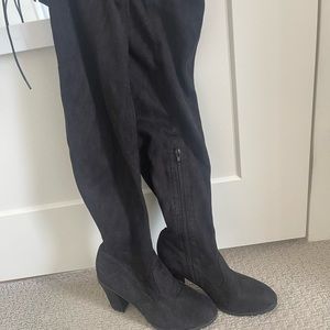 Black thigh high heeled boots